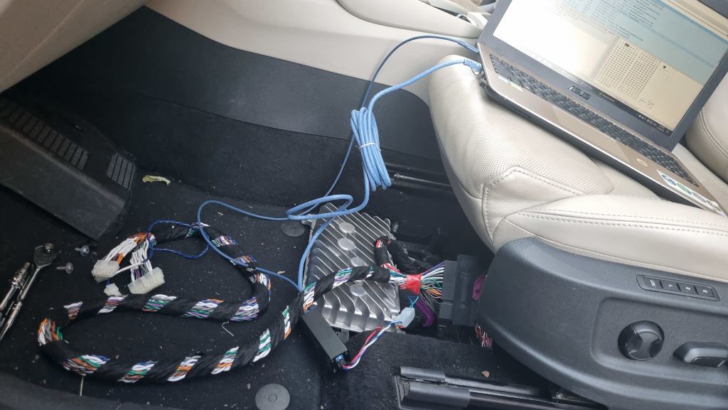 The modified adapter harness connected to the car amplifier and to the laptop